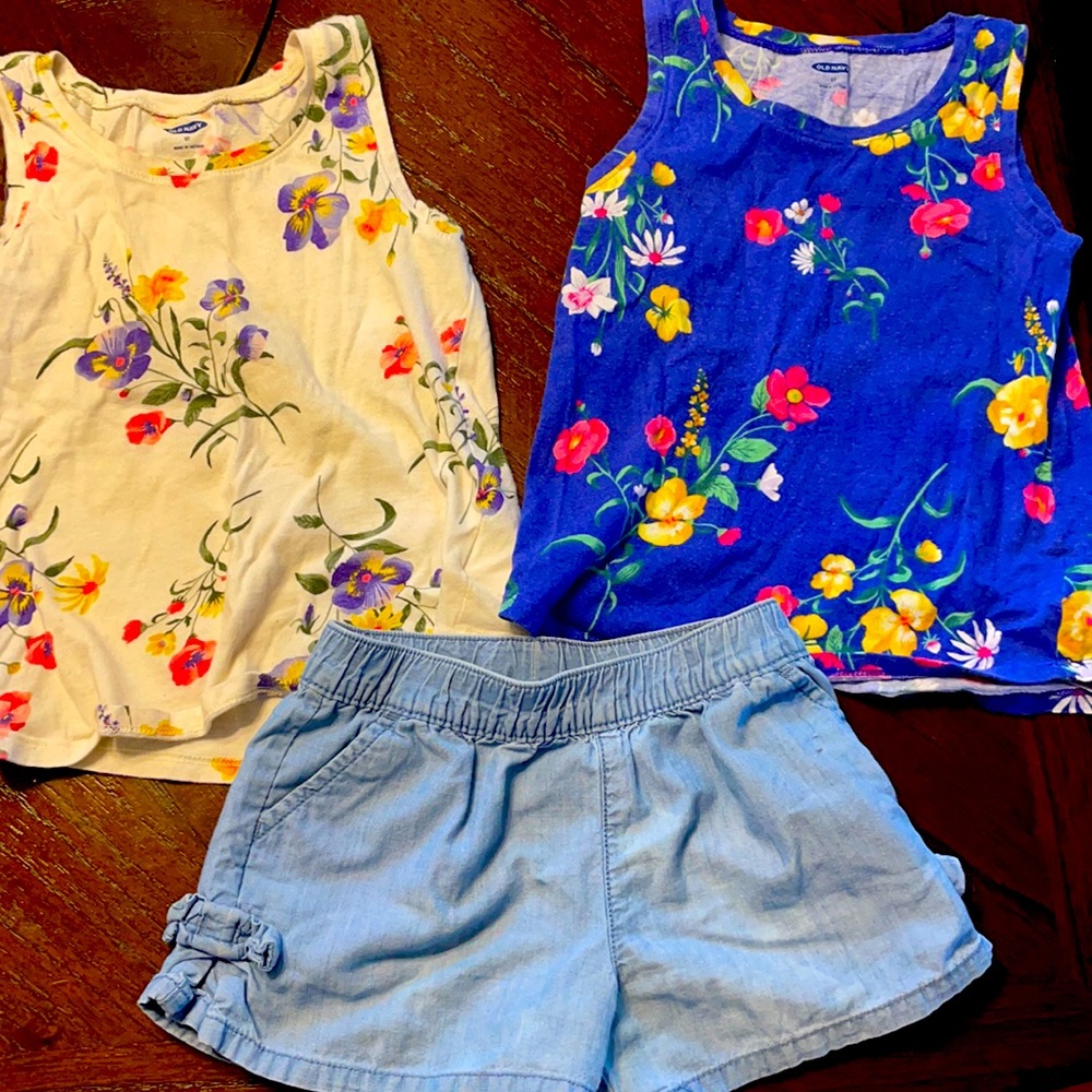 2 shirts and blue shorts